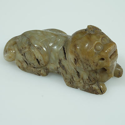 Chinese Mottled and Calcified Jade Figure of a Lion Ming Dynasty