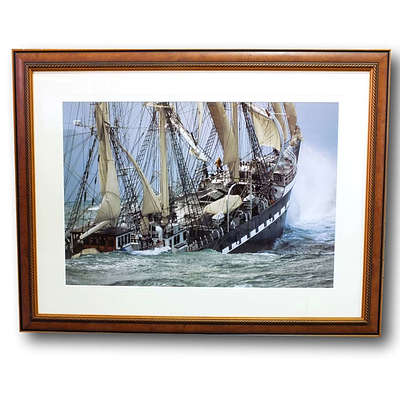Framed Picture of a Ship Breaking Through the Waves