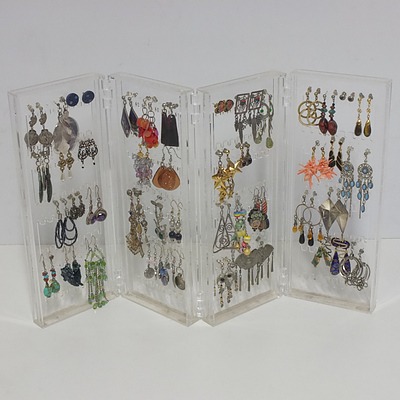 Assortment of Earrings and Stand