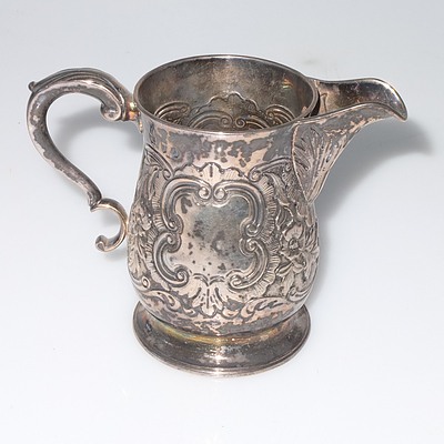 Georgian Irish Sterling Silver Jug with Repousse Floral Scroll Decoration