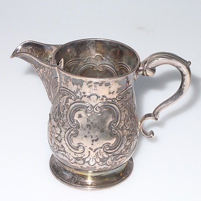 Georgian Irish Sterling Silver Jug with Repousse Floral Scroll Decoration