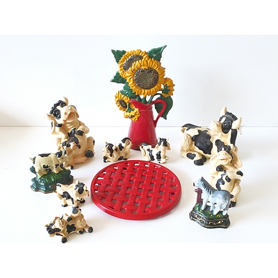 Cast Iron Door Stoppers and a Collection of Decorative Cows