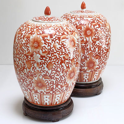 Pair of Chinese Coral Red Decorated Jars on Rosewood Stands