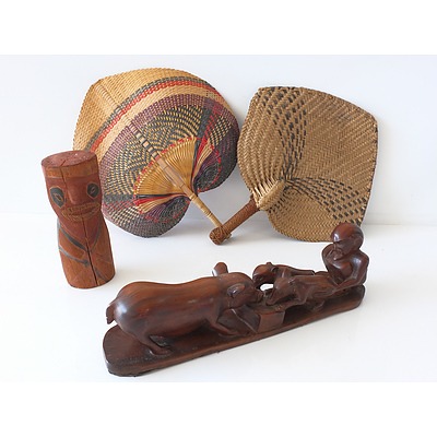 Collection of Polynesian Items Including Fans, Carving, and Aboriginal Totem