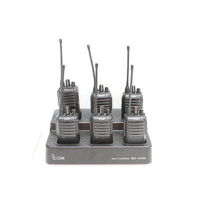 Six Icom IC-F4003 Portable UHF Radios and Multi Charging Station