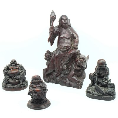 Three Resin Buddhas and A Wood Carving of Buddha Riding a Lion