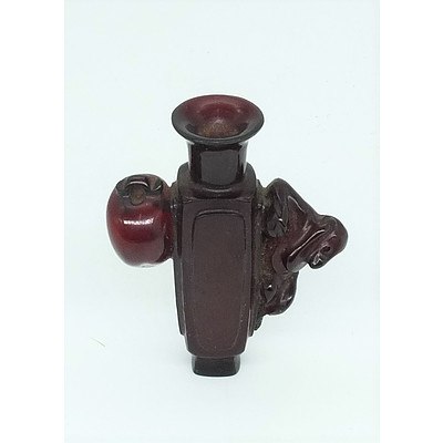 Chinese Amber Resin Pendant Carved as an Urn with Monkey and Peach