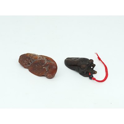Two Chinese Carved Hardstone Pendants