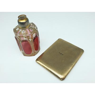 Cigarette Case Initialled NMS 1929 and a Glass and Enamel Perfume Bottle