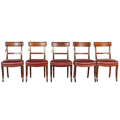 Five Regency Period Mahogany Sabre Leg Dining Chairs with Maroon Leather Upholstery Circa 1815