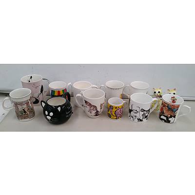 Collection of Cat Figures and Cat Decorated Mugs