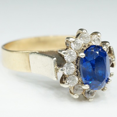 9ct Yellow Gold with White Gold Setting and Shoulders with Oval Facetted Blue Paste and White Imitations Stones Around
