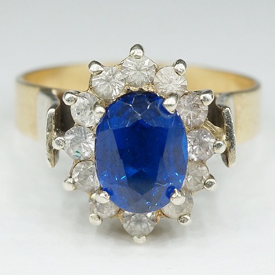 9ct Yellow Gold with White Gold Setting and Shoulders with Oval Facetted Blue Paste and White Imitations Stones Around