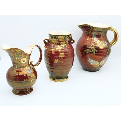 Crown Devon Red Luster Water Pitchers and Vase With Gilt Floral and Butterfly Motifs