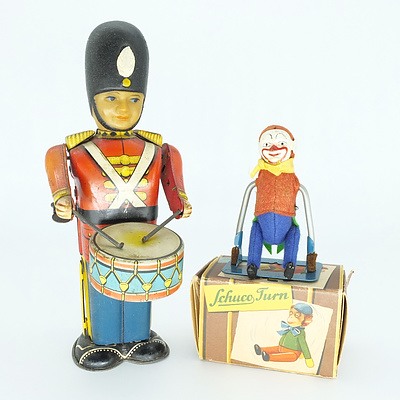 Vintage Tin Wind Up Soldier and a Schuco Turn Clown 882