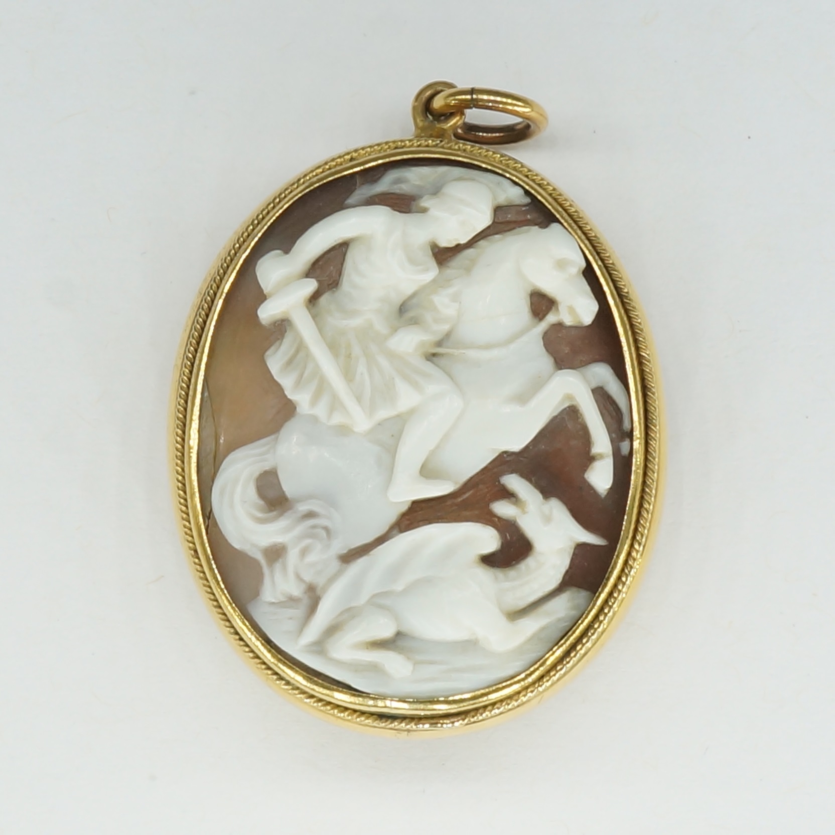 'Gold Plated and Carved Shell Cameo Pendant Depicting Saint George Slaying the Dragon'