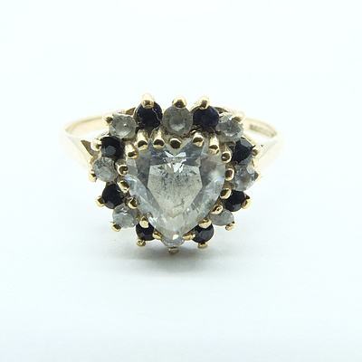 9ct Yellow Gold Heart Shaped Cubic Zirconia with round Cubic Zirconia and Dark Sapphire Surround