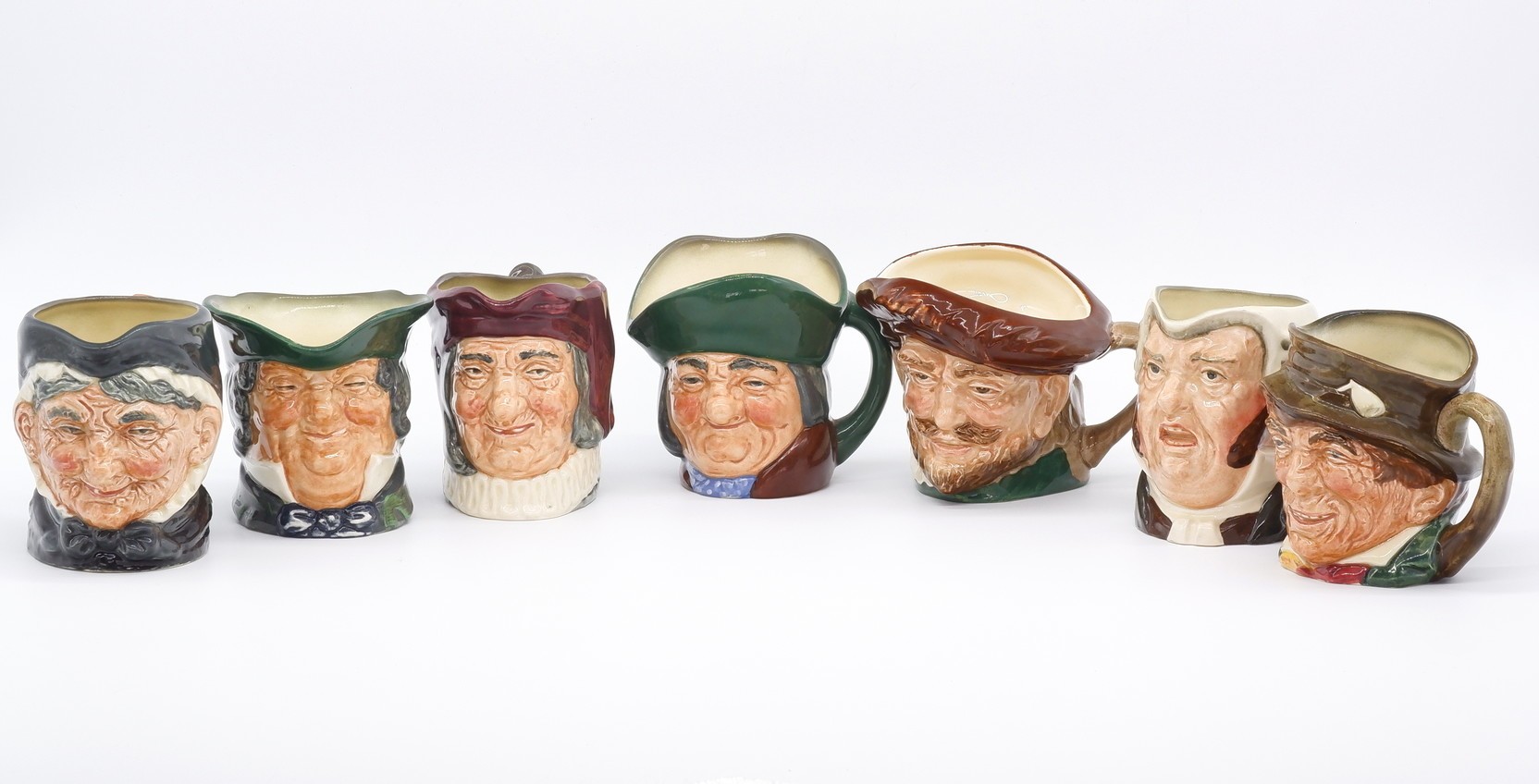 'Collection of Seven Royal Doulton Toby Jugs'