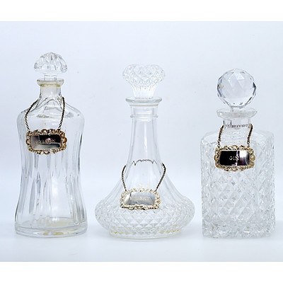 Two Cut Crystal Decanters and One Moulded Glass Decanter
