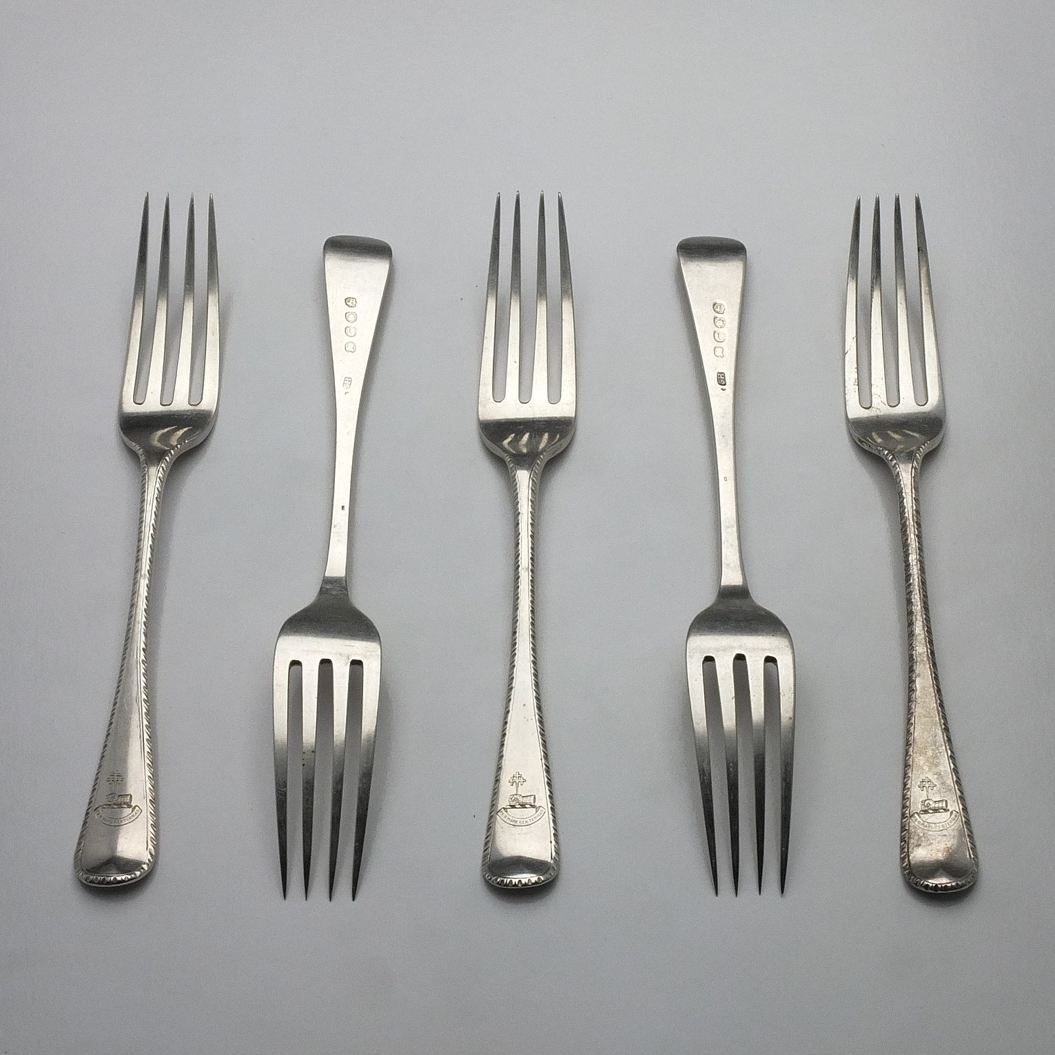 'Five George III Crested Sterling Silver Entree Forks London 1815'
