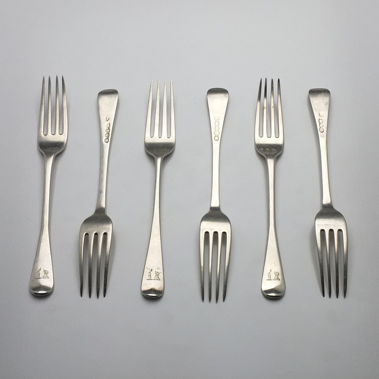 'Six Georgian Crested Sterling Silver Entree Forks Including Four William Eley & William Fearn London 1821'