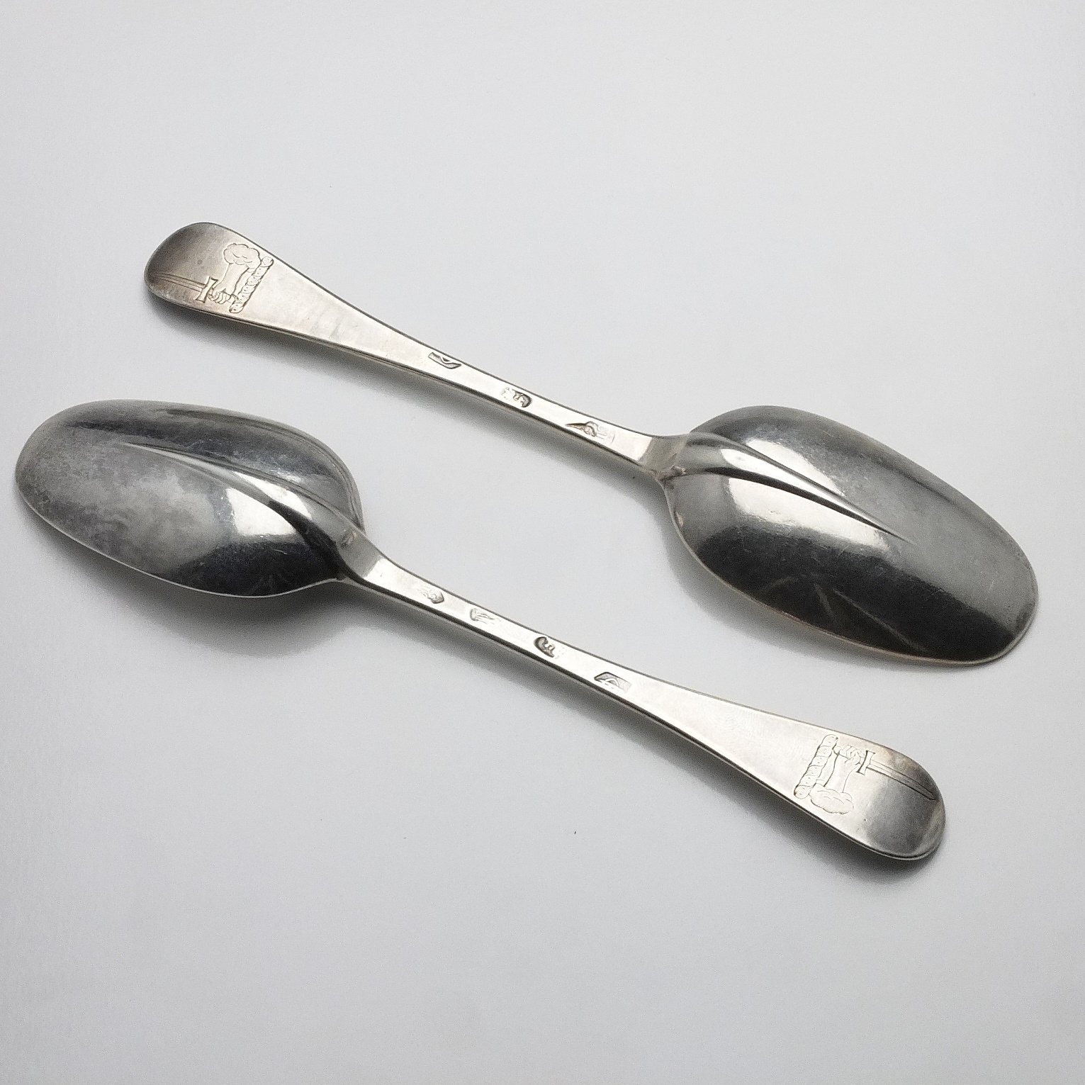 'Two George I Crested Sterling Silver Table Spoons Newcastle 1717'