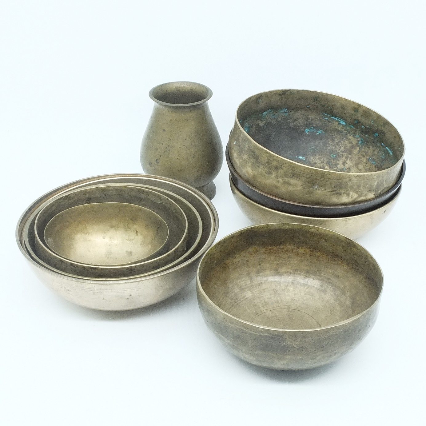 'Group of Graduating Brass Bowls and a Vase'
