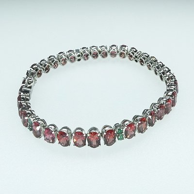 Silver Tennis Bracelet with Oval Garnet and Small Round Emeralds