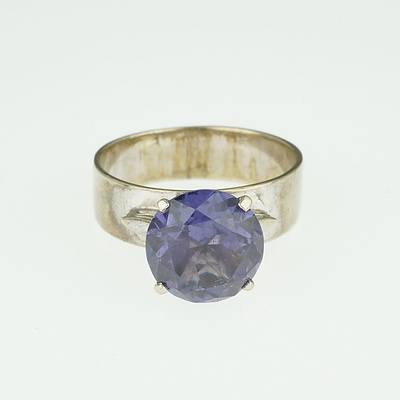 9ct White Gold Ring with Round Mauve Synthetic Sapphire To Imitate Alexandrite in a Four Claw Setting