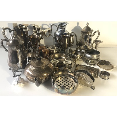 Large Group of Silver Plate, Include Candle Sticks, Coffee Pots, Water Pitcher and More
