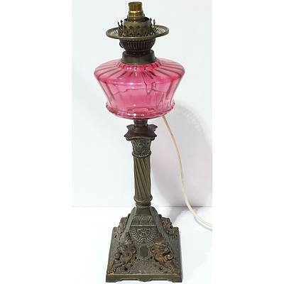 Antique Cast Metal and Ruby Glass Oil Lamp