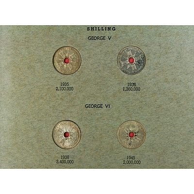 Folder with pre-WW2 New Guinea coins including silver Shillings