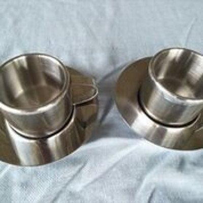 Pair of SUNBEAM stainless steel coffee cups with saucers