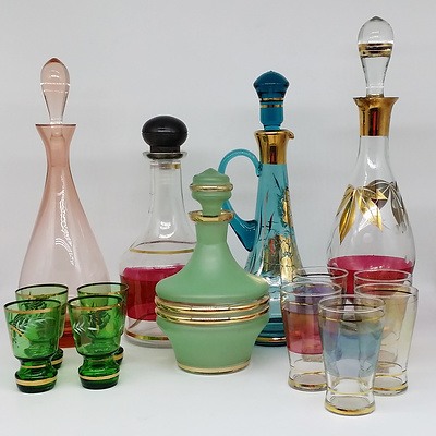 Five Decorative Glass Decanters with Glasses