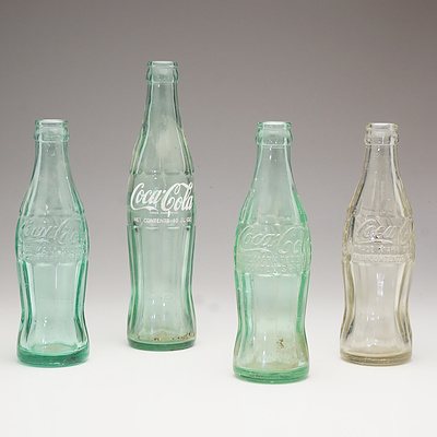 Four Vintage Coca Cola Fluid Ounce Glass Bottles