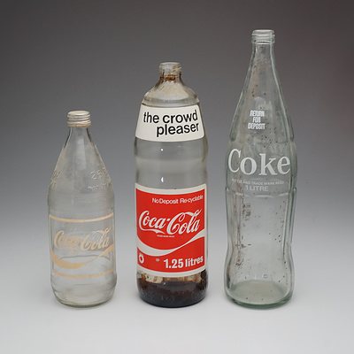 Three Coca Cola Glass Bottles, Including 26 FL OZ Bottle