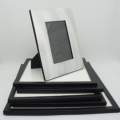 Five Assorted Black Photo Frames and One Metallic Photo Frame