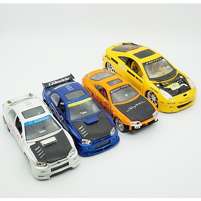 Four Model Cars, Including Jada Toyota Celica, Toyota Supra and two Subaru Impreza WRX