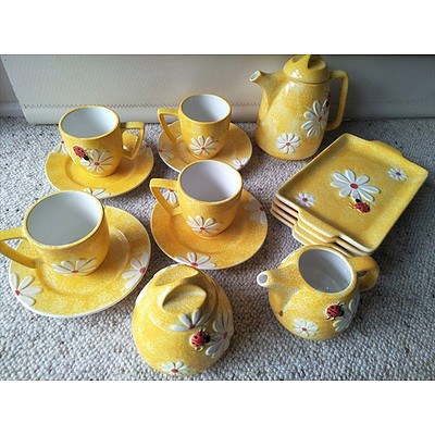 15 piece yellow ceramic teaset with Ladybird pattern