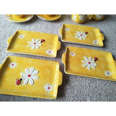 15 piece yellow ceramic teaset with Ladybird pattern