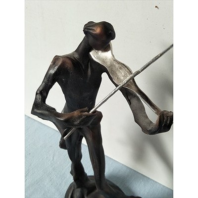 Statue of Man Playing Violin