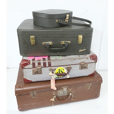 Three Travel Suitcases and a Vanity Case