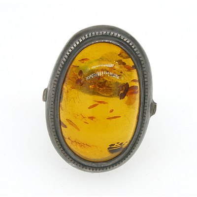 Sterling Silver Ring with Oval Cabochon of Amber