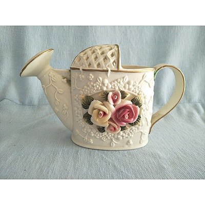 Ceramic watering can ornament with floral motif