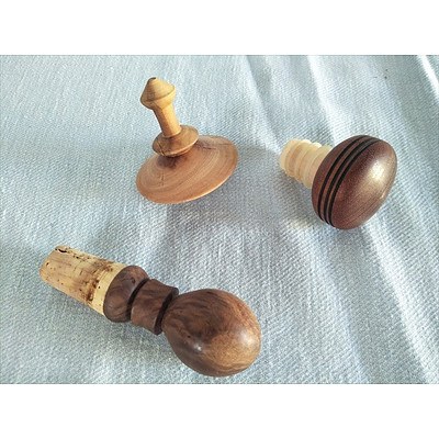 Handcarved wooden bottle stoppers x 2 and wooden spinning top