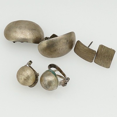 Two Pairs of Silver Clip on Earrings and One Pair of Flat Silver Studs