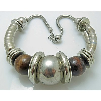 Dramatic designer necklace - silver tone with wooden beads.