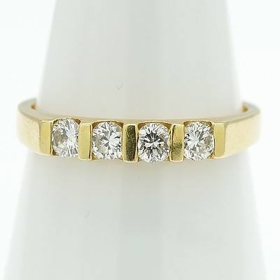 18ct Yellow Gold Ring With Four Round Brilliant Cut Diamonds in a Row of Bar Setting