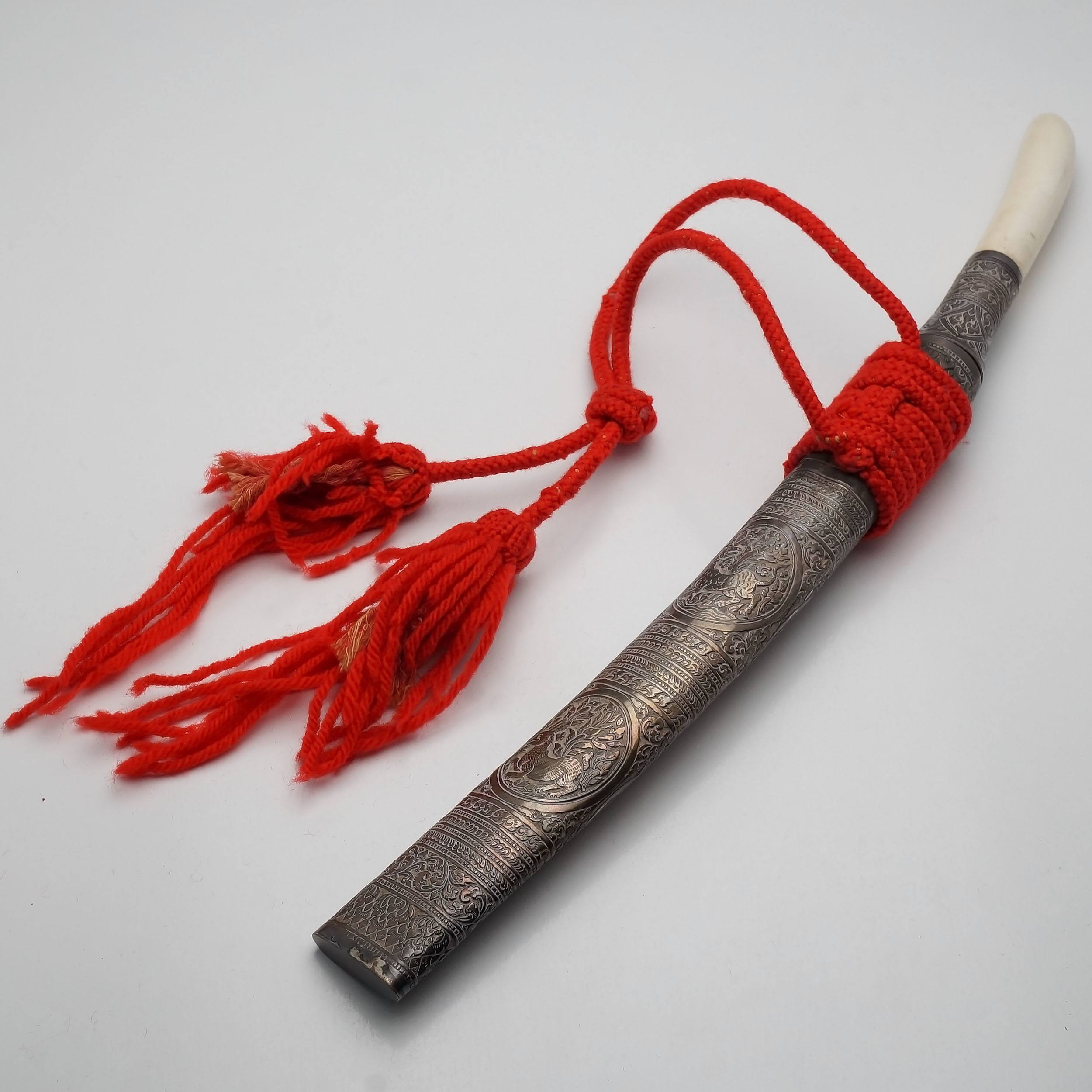 'Lao Ivory Handled Ceremonial Sword With Engraved Silver Sheath and Red Woven Tassels'