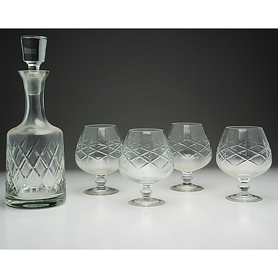Four Cut Glass Brandy Balloons, Five Cut Glass Whisky Tumblers, and One Cut Glass Bell Shaped Decanter